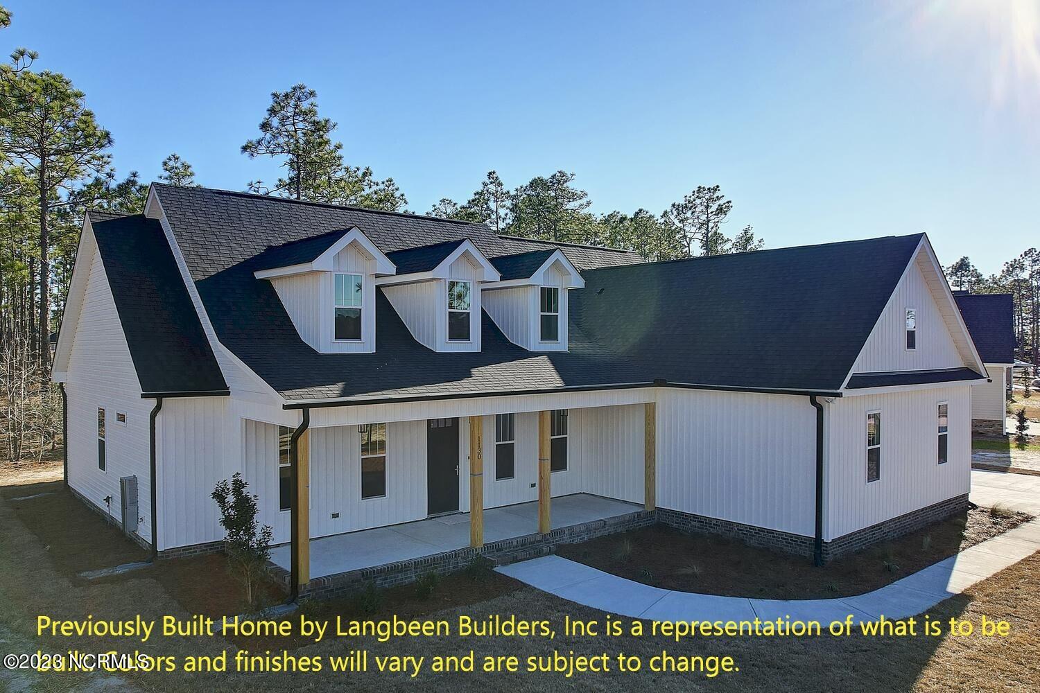 1032 Nicklaus Road Southport, NC 28461 - Photo 8 of 23 Previously Built Home by Langbeen Builders, Inc is a representation of what is to be built. Colors and finishes will vary and are subject to change.