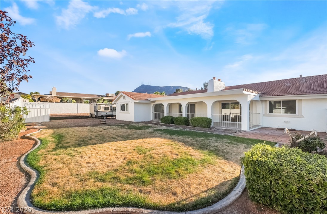429 Crestway Road Henderson, NV 89015 - Photo 46 of 56 A terracotta-tiled roof and arched patio grace this welcoming single-story dwelling.