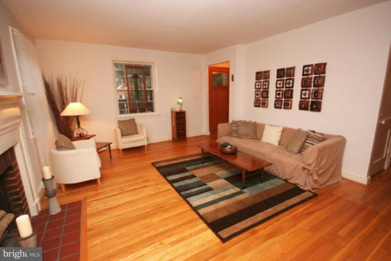 9220 Whitney Street Silver Spring, MD 20901 - Photo 2 of 30 a living room with furniture rug and wooden floor
