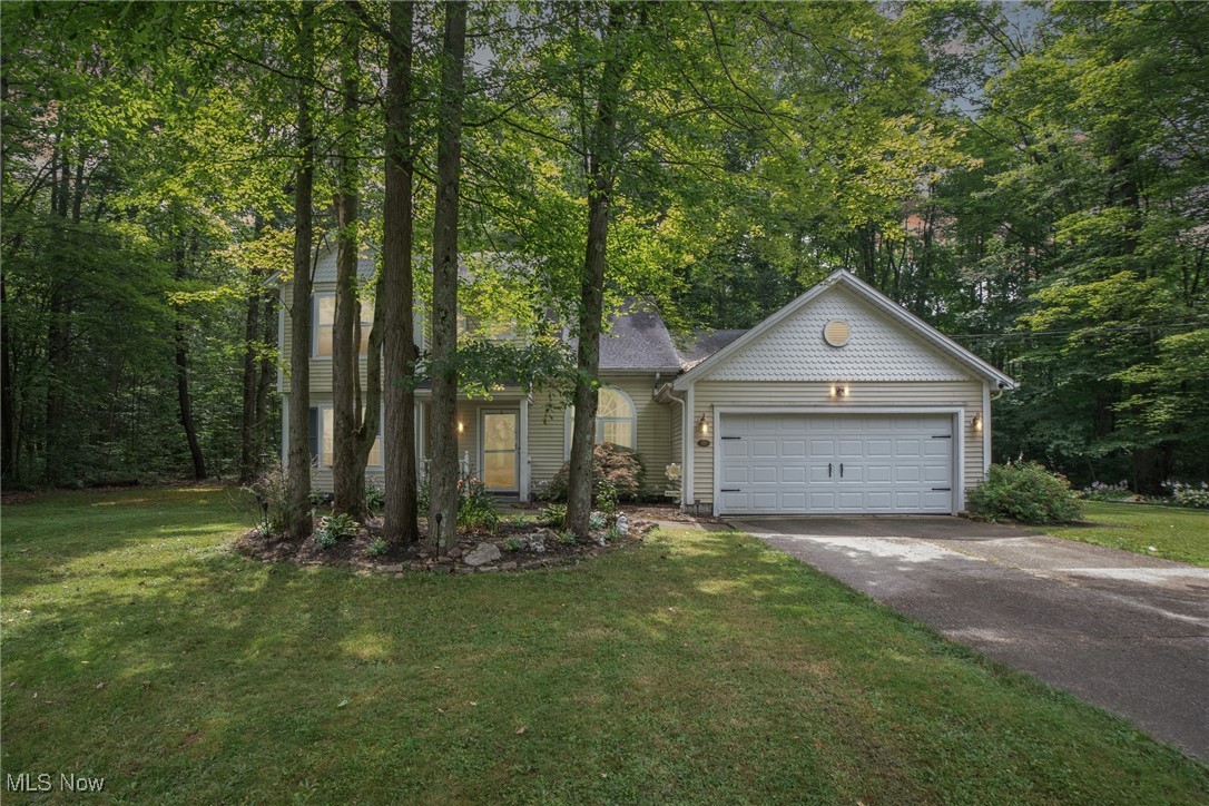 938 Long Shadow Lane Rome, OH 44085 - Photo 5 of 48 View of front of property with concrete driveway, an attached garage, and a front yard