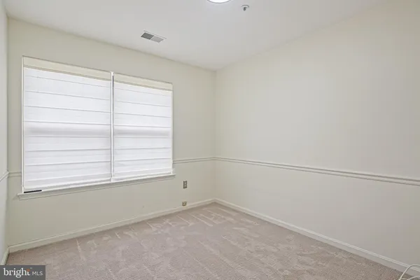 a view of a room that has a window in it