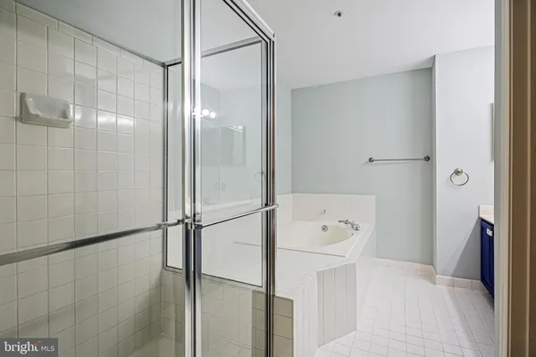a bathroom with a shower and a sink