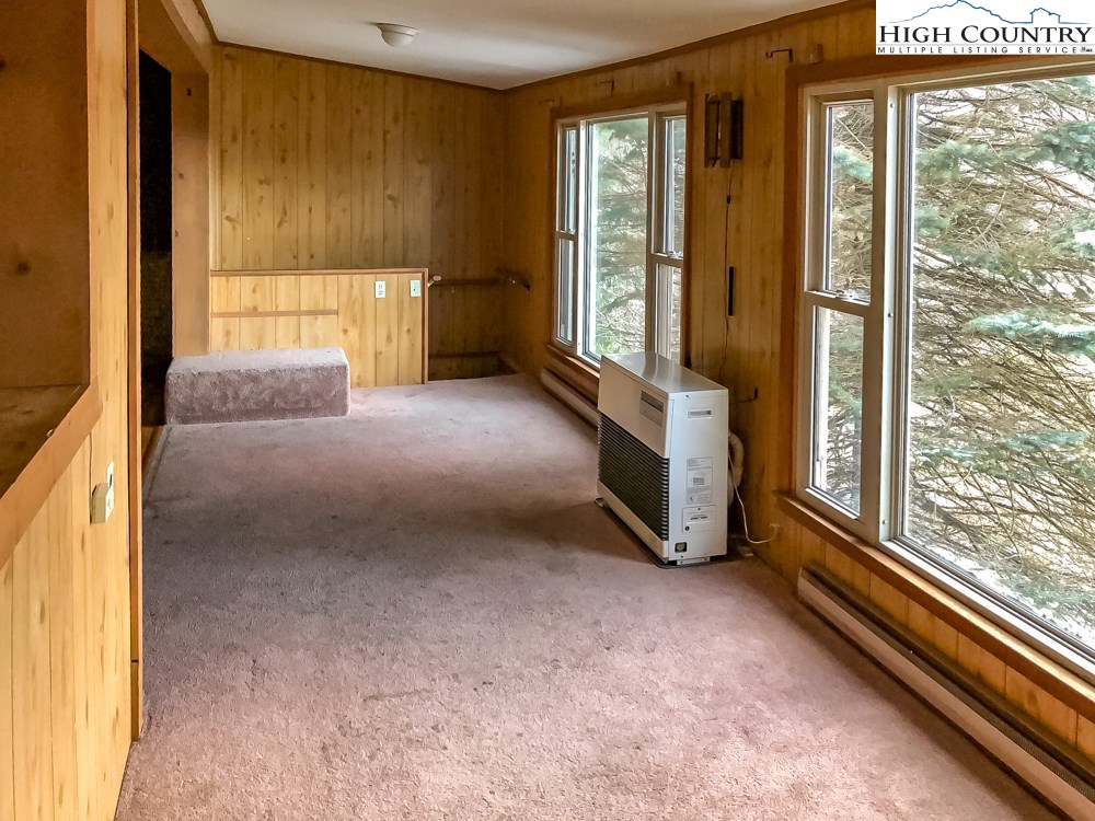 277 Rabbit Run Road, Unit A&B Boone, NC 28607 - Photo 12 of 19 a view of an empty room with a window