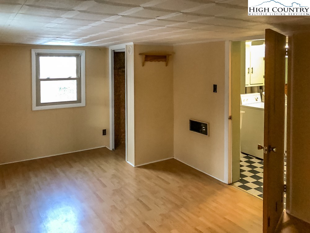 277 Rabbit Run Road, Unit A&B Boone, NC 28607 - Photo 13 of 19 an empty room that has a wooden cupboard