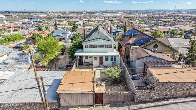 a kitchen with wooden cabinets and a sink