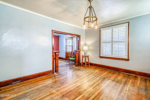a view of a kitchen with stainless steel appliances granite countertop a sink and cabinets