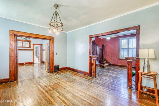 a view of a room with wooden floor