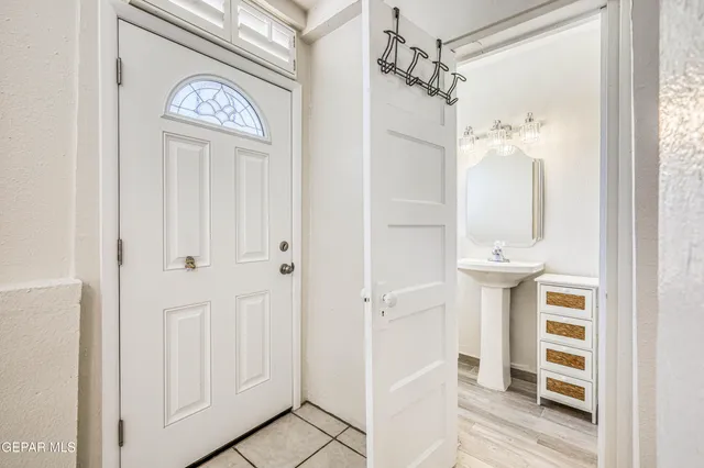 a bathroom with a shower curtain and a sink