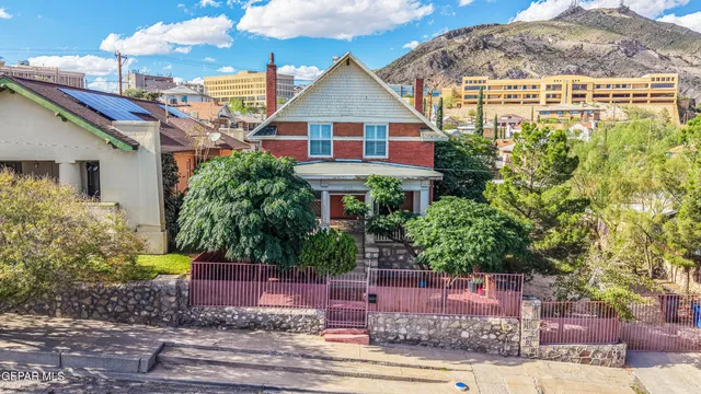 a front view of a house with a yard and a garage