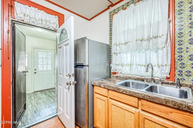 a living room with furniture a wooden floor and a chandelier
