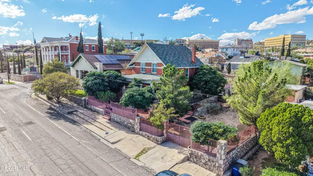a view of a dining room with furniture and a chandelier