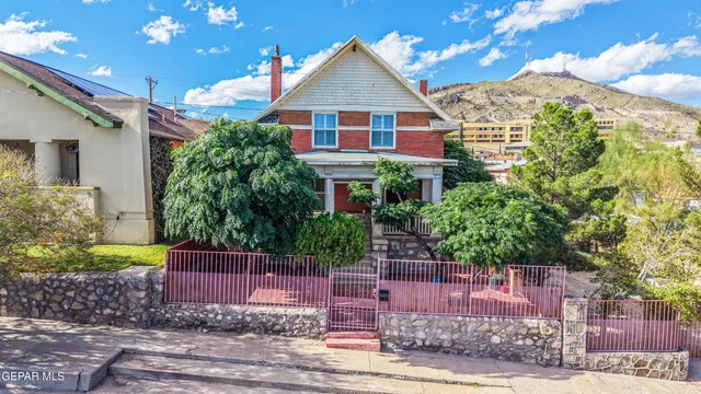 a bathroom with a sink a mirror and a window
