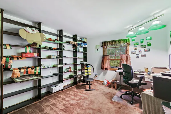 a view of a workspace with furniture