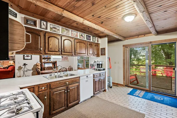 a open kitchen with stainless steel appliances granite countertop a stove and cabinets