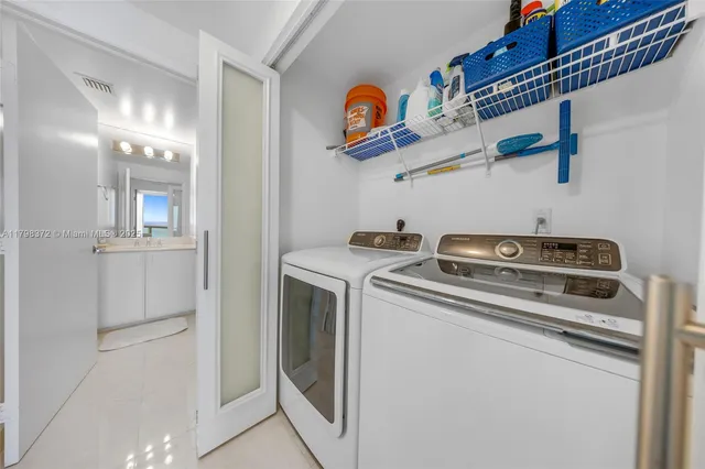 a utility room with dryer and washer