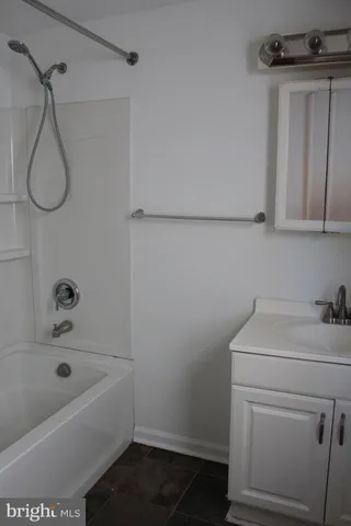 a bathroom with a sink and vanity
