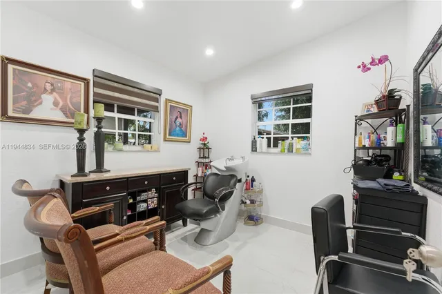a room with furniture a piano and wooden floor