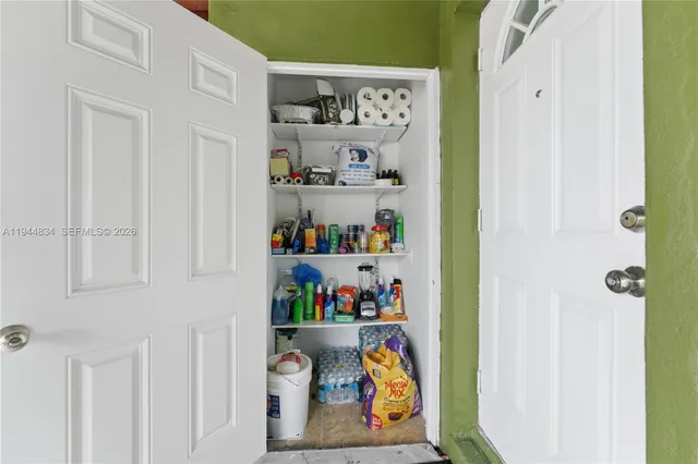 a shelf with books and knick knacks on it