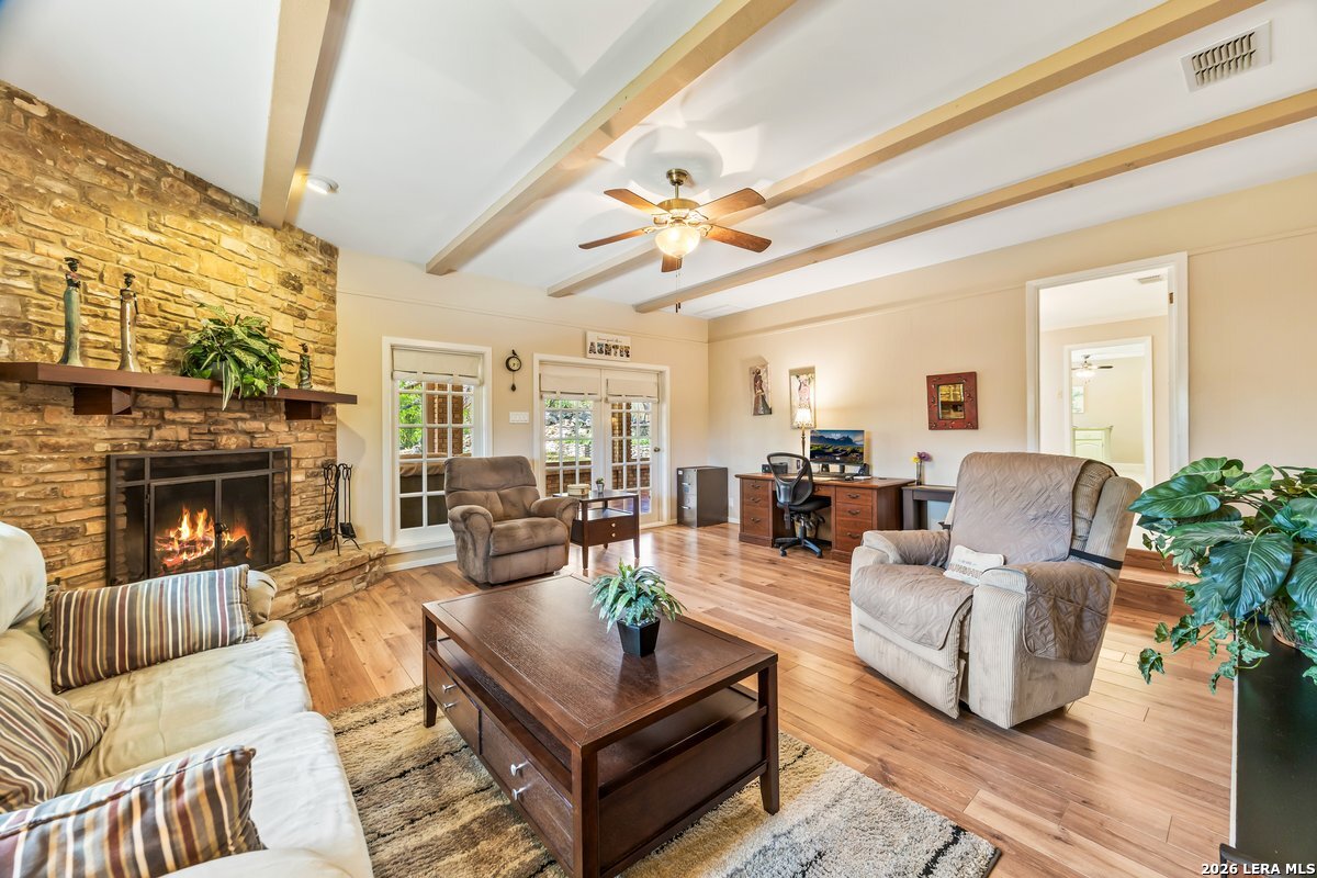 9106 Sundew Circle Garden Ridge, TX 78266 - Photo 11 of 29 a living room with furniture and a fireplace