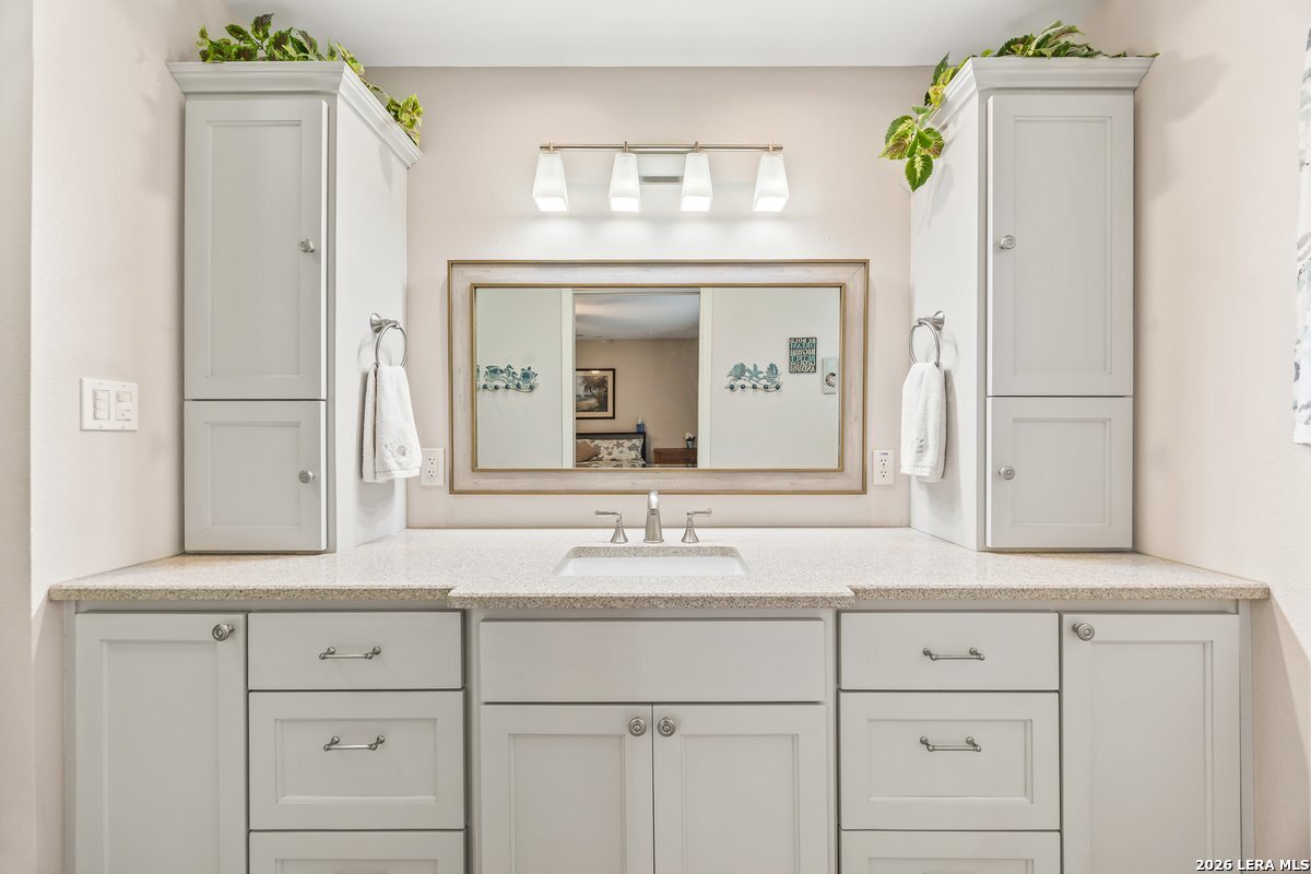 9106 Sundew Circle Garden Ridge, TX 78266 - Photo 13 of 29 a bathroom with vanity granite and a sink
