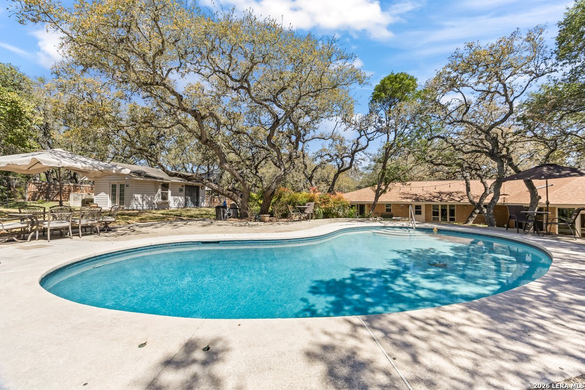9106 Sundew Circle Garden Ridge, TX 78266 - Photo 23 of 29 a view of a swimming pool with outdoor seating