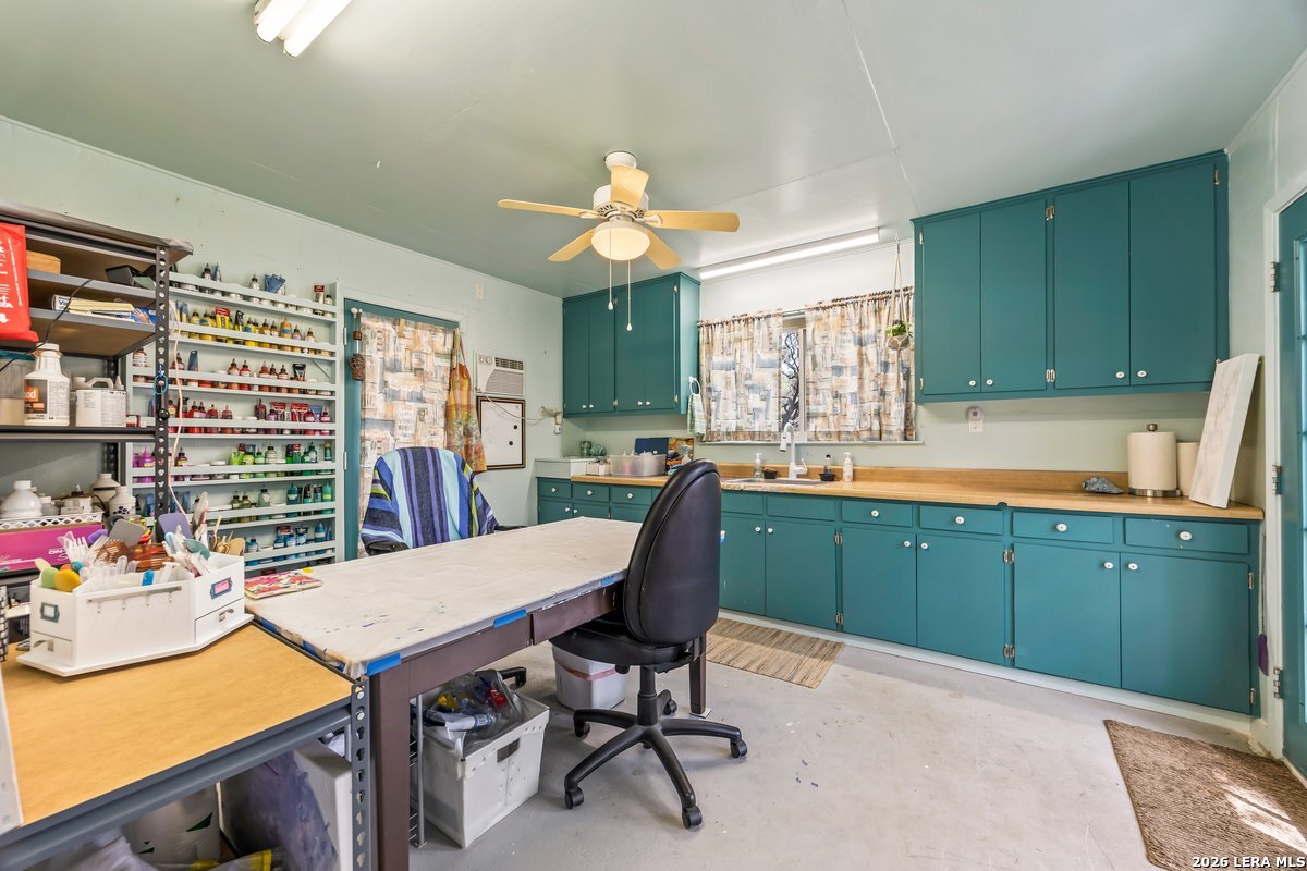 9106 Sundew Circle Garden Ridge, TX 78266 - Photo 26 of 29 a kitchen with cabinets table and chairs