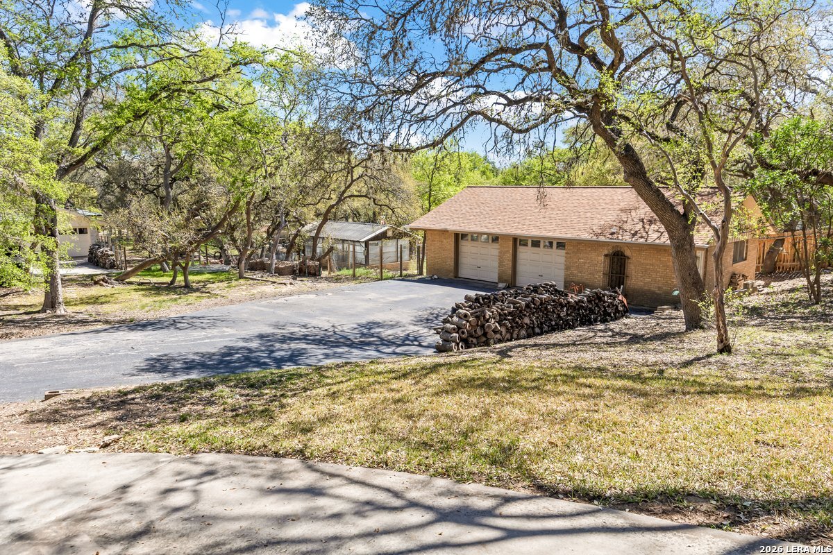 9106 Sundew Circle Garden Ridge, TX 78266 - Photo 27 of 29 a view of a house with a yard