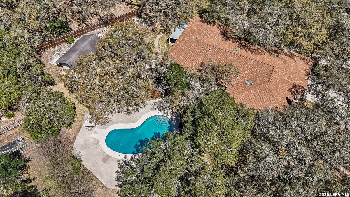9106 Sundew Circle Garden Ridge, TX 78266 - Photo 28 of 29 an aerial view of a house with a yard and large trees