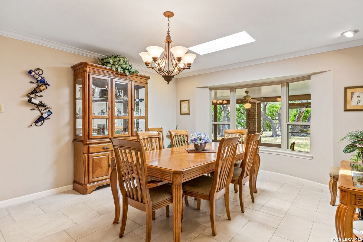 9106 Sundew Circle Garden Ridge, TX 78266 - Photo 7 of 29 a view of a dining room with furniture window and outside view