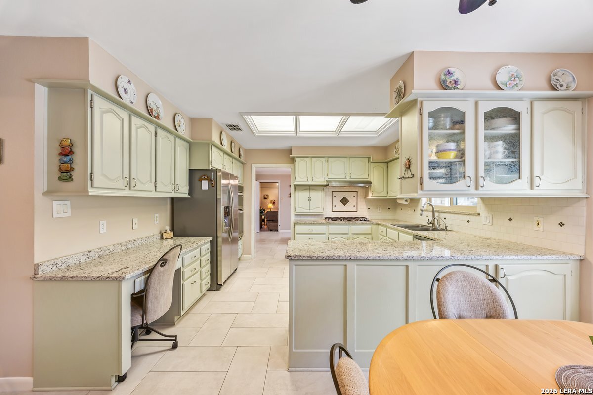 9106 Sundew Circle Garden Ridge, TX 78266 - Photo 8 of 29 a bathroom with a granite countertop sink and a mirror