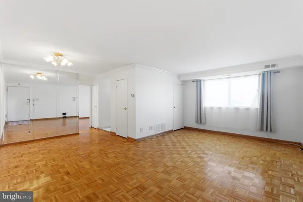 a view of an empty room with a window