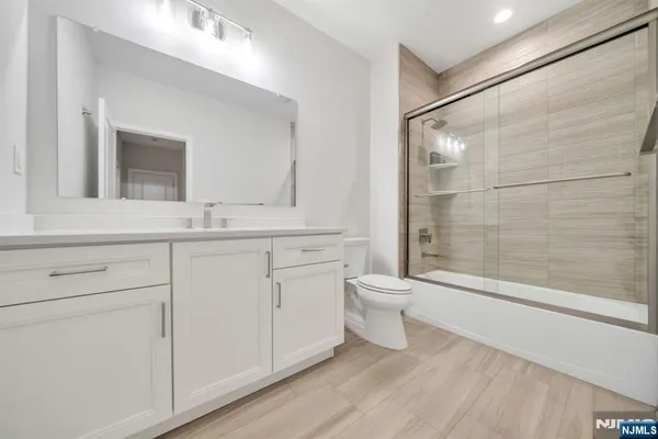 a bathroom with a toilet sink and a shower