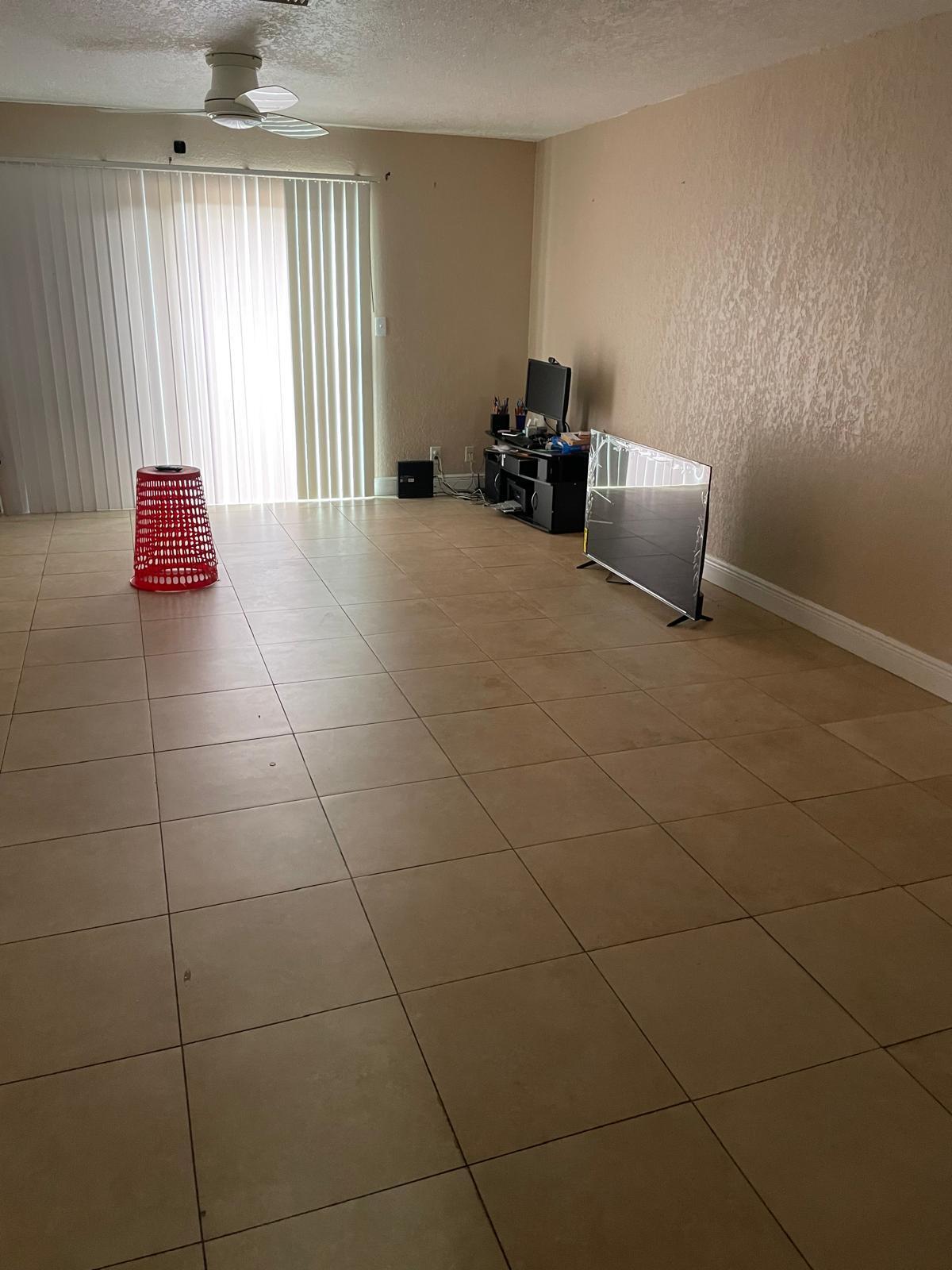 8249 Fairway Road Sunrise, FL 33351 - Photo 12 of 12 a bed room with a bed and a chair