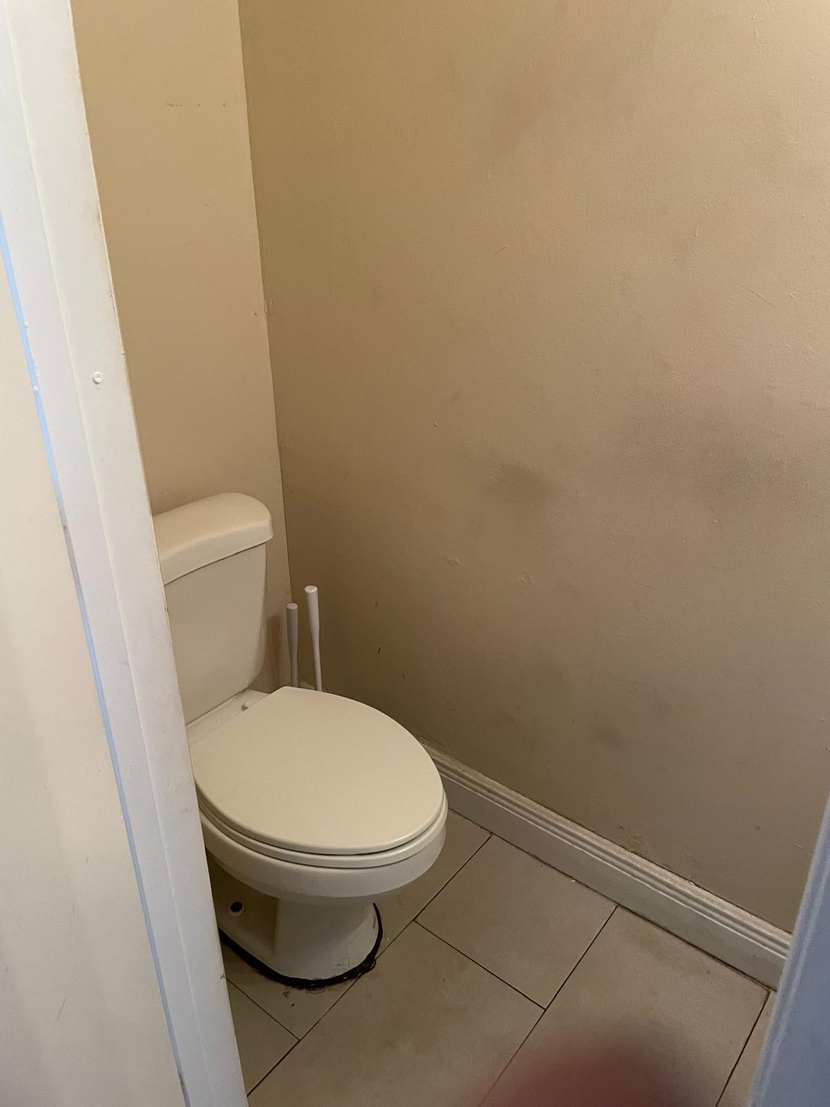 8249 Fairway Road Sunrise, FL 33351 - Photo 3 of 12 a white toilet sitting next to a shower