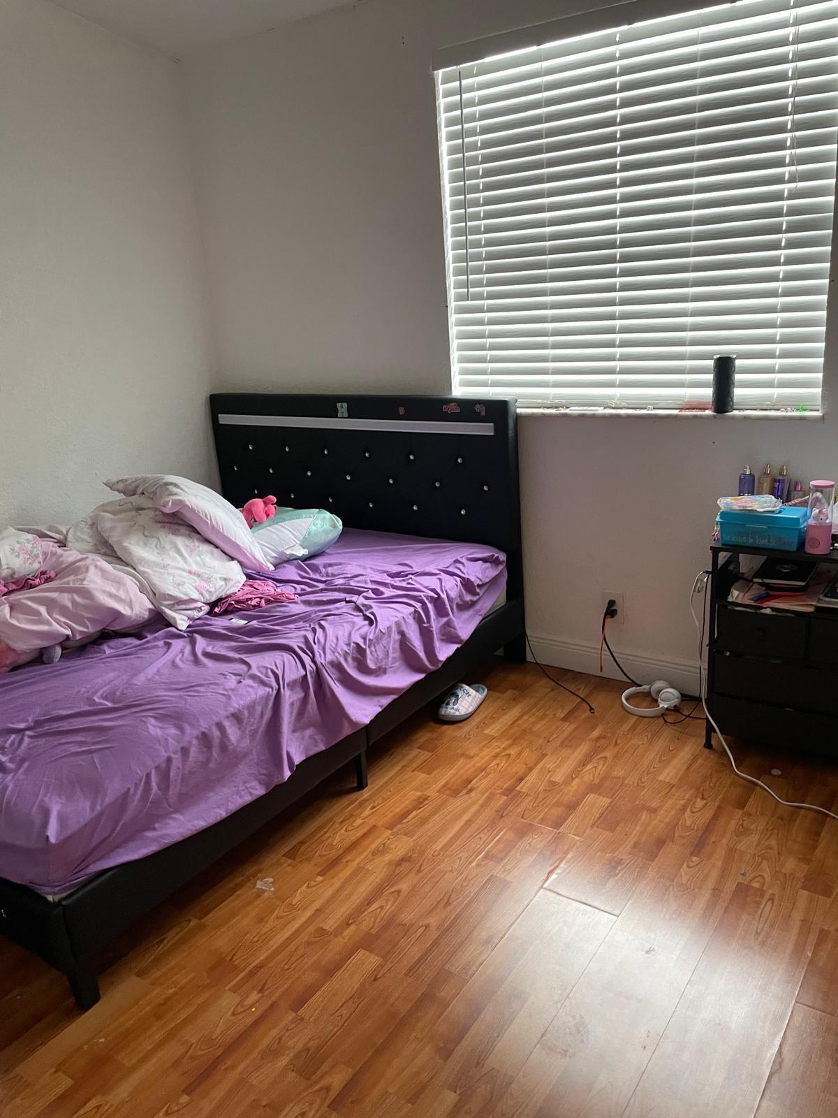 8249 Fairway Road Sunrise, FL 33351 - Photo 7 of 12 a bedroom with a bed and a window