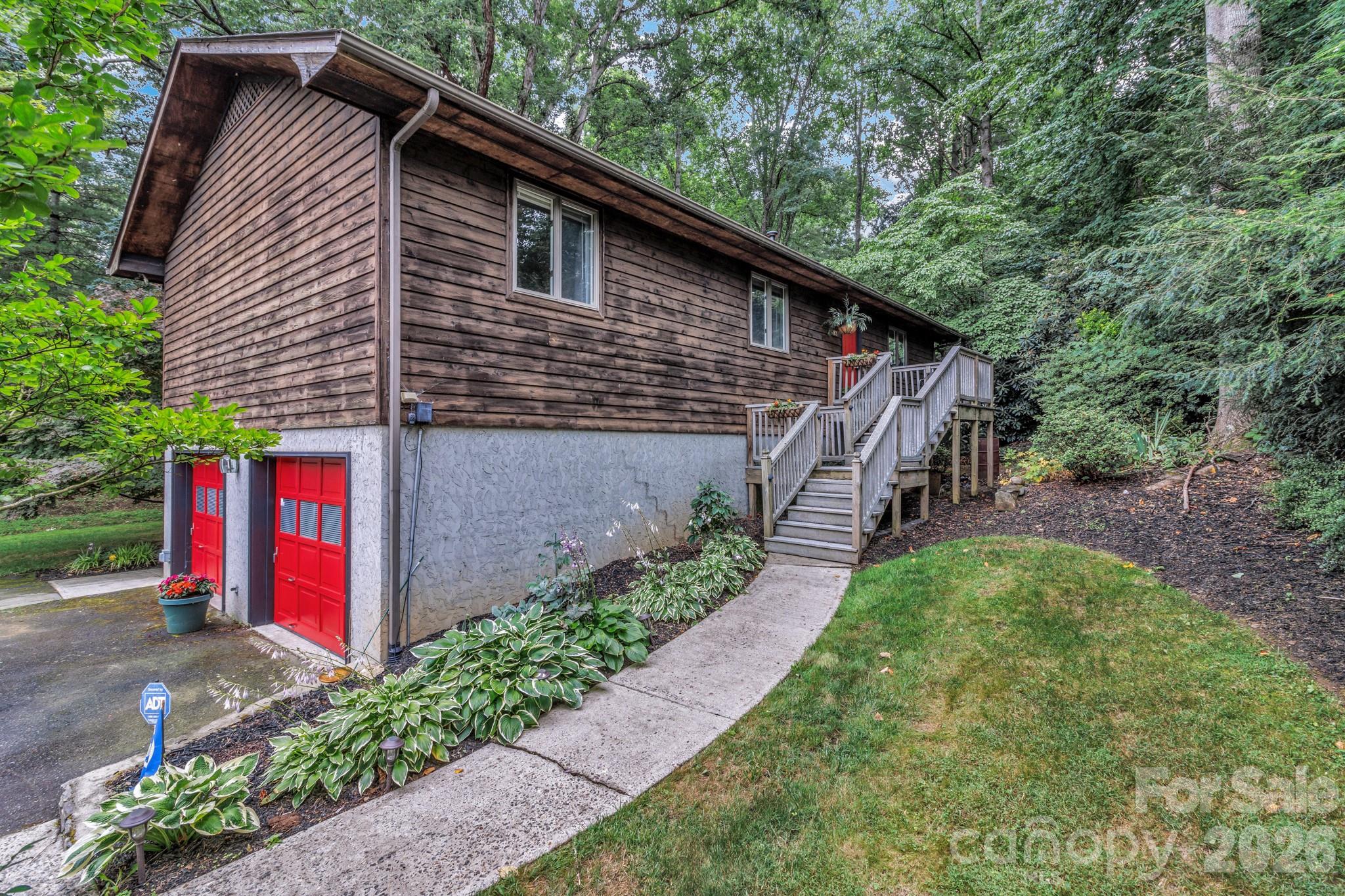603 Rose Hill Road Asheville, NC 28803 - Photo 1 of 43 a backyard of a house with lots of green space