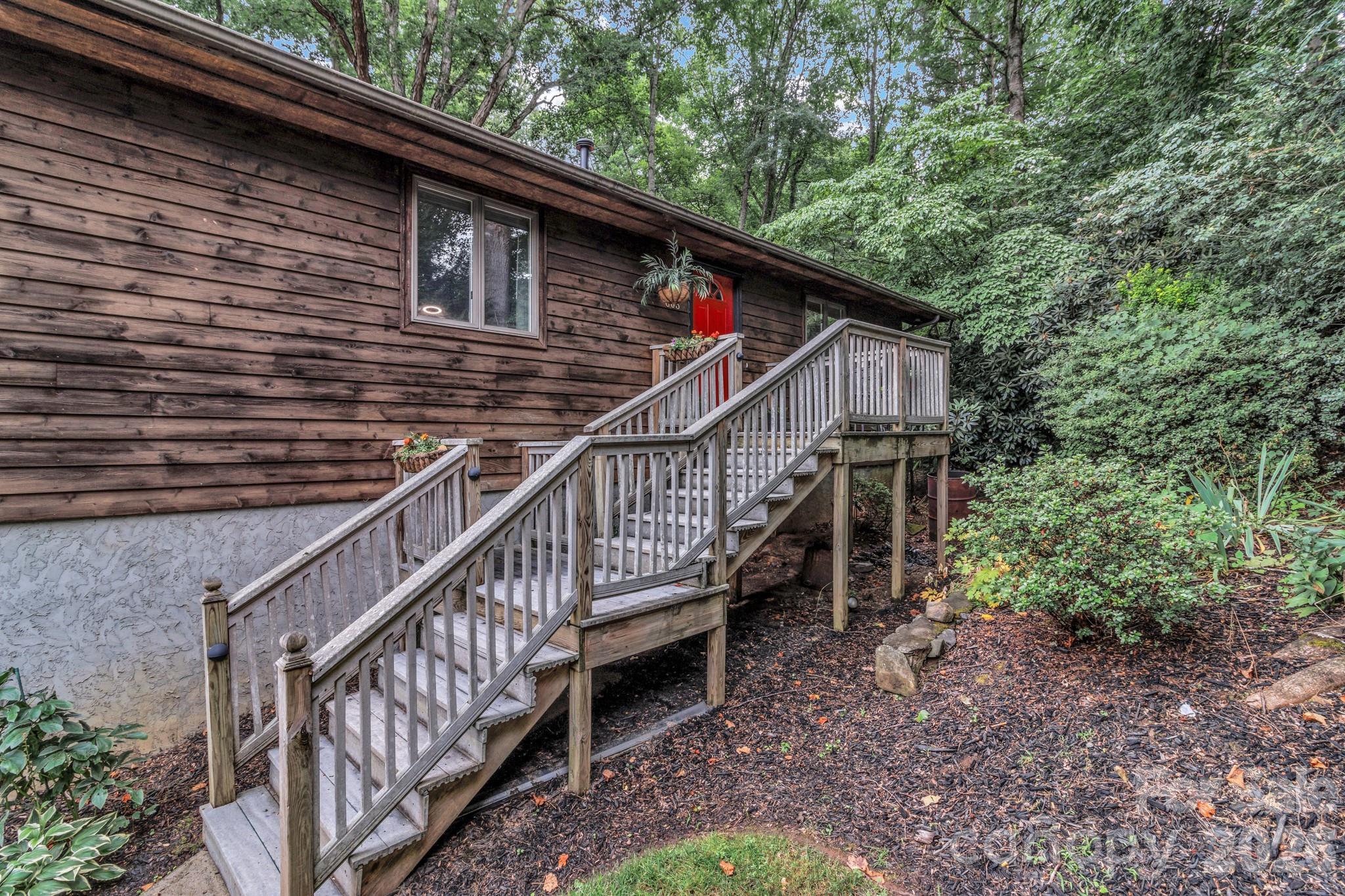 603 Rose Hill Road Asheville, NC 28803 - Photo 2 of 43 a view of a house with backyard and trees