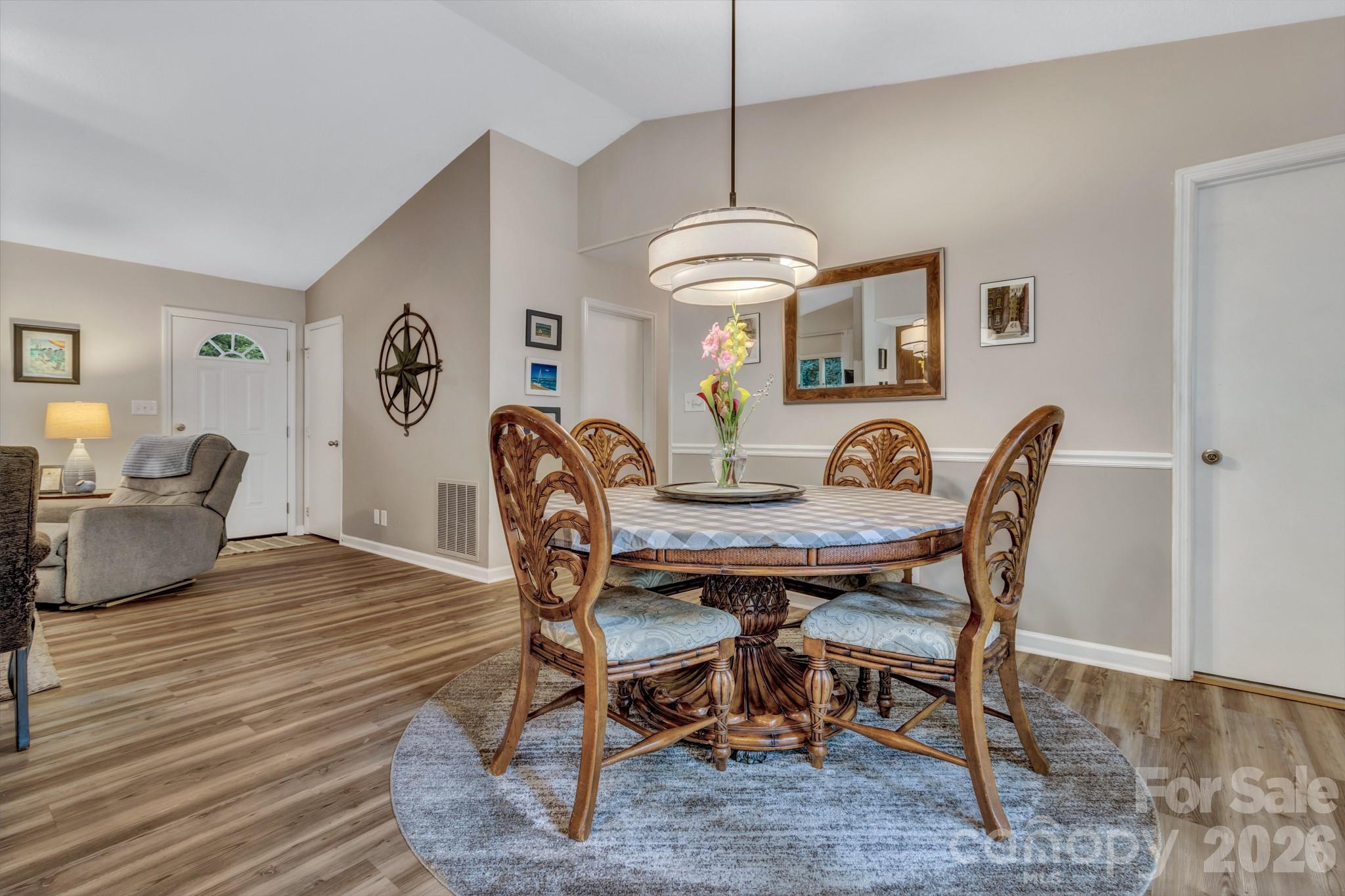 603 Rose Hill Road Asheville, NC 28803 - Photo 22 of 43 a view of a dining room with furniture window and wooden floor