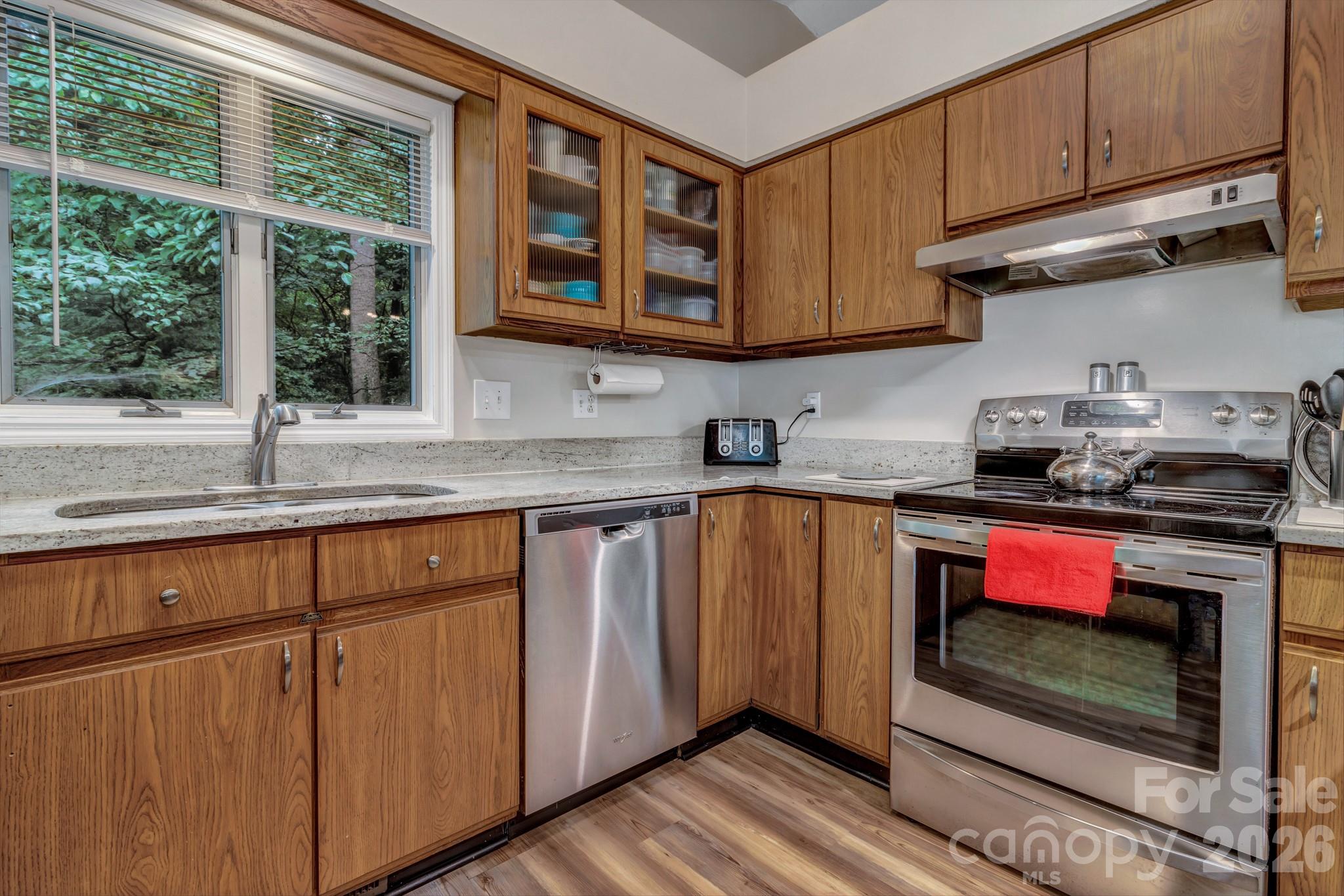 603 Rose Hill Road Asheville, NC 28803 - Photo 26 of 43 a kitchen with stainless steel appliances granite countertop a stove a sink and dishwasher