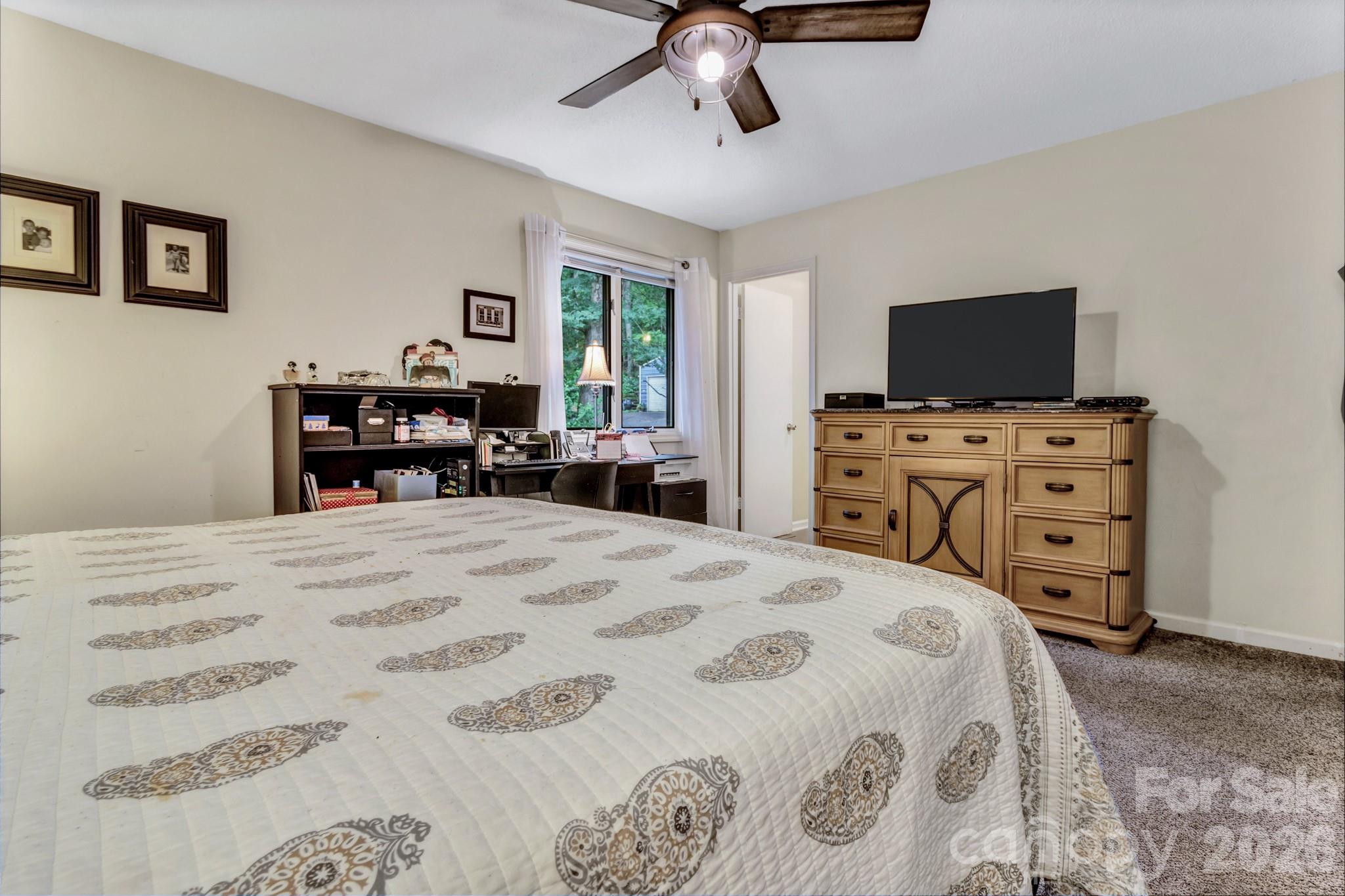 603 Rose Hill Road Asheville, NC 28803 - Photo 30 of 43 a bedroom with a bed and furniture