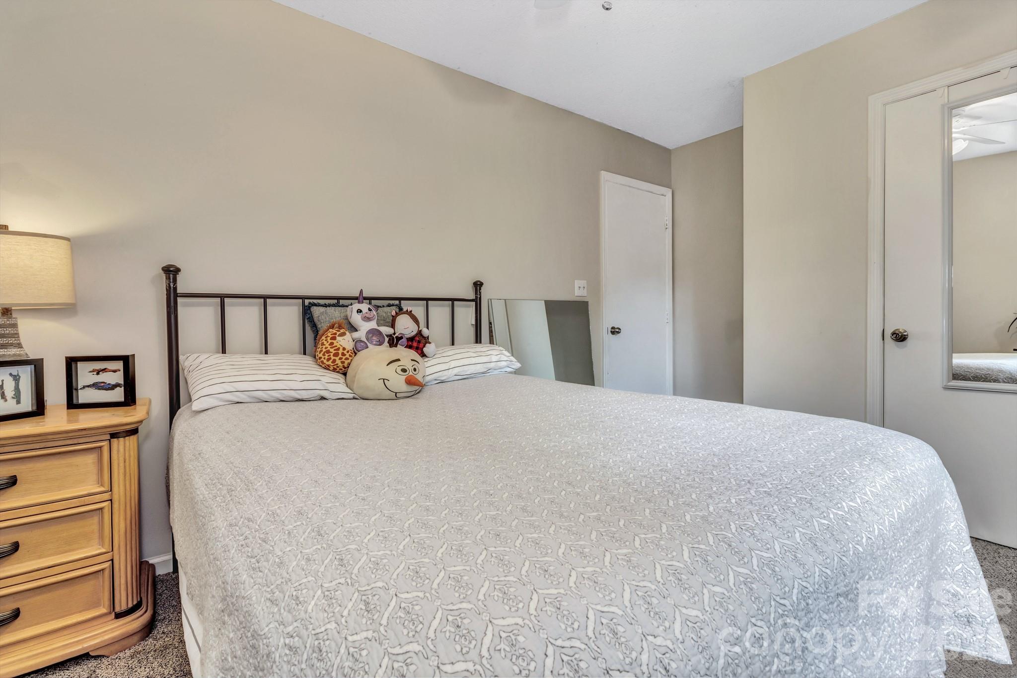 603 Rose Hill Road Asheville, NC 28803 - Photo 34 of 43 a large bed sitting in a bedroom and table