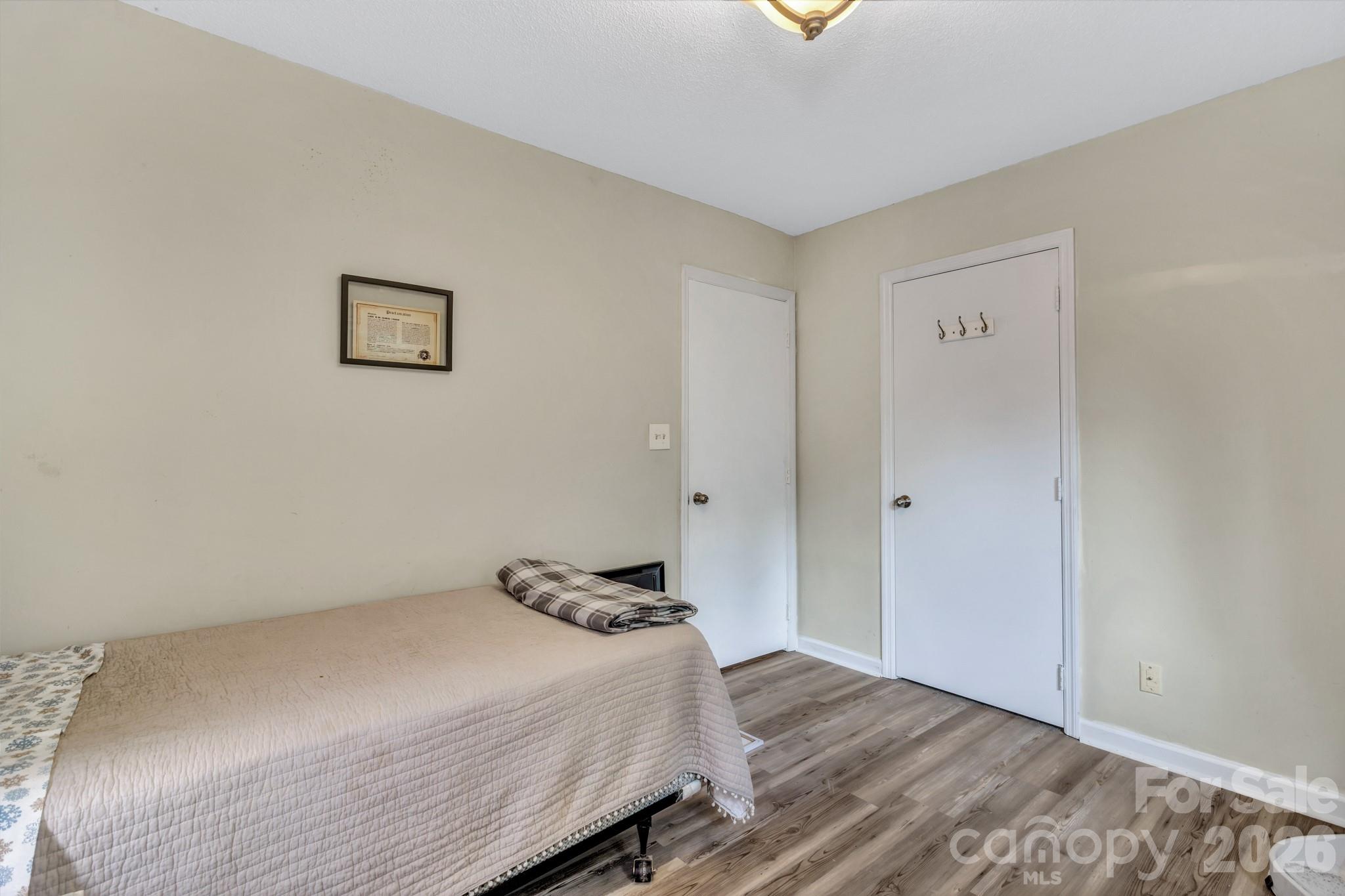 603 Rose Hill Road Asheville, NC 28803 - Photo 35 of 43 a bedroom with a bed and a window