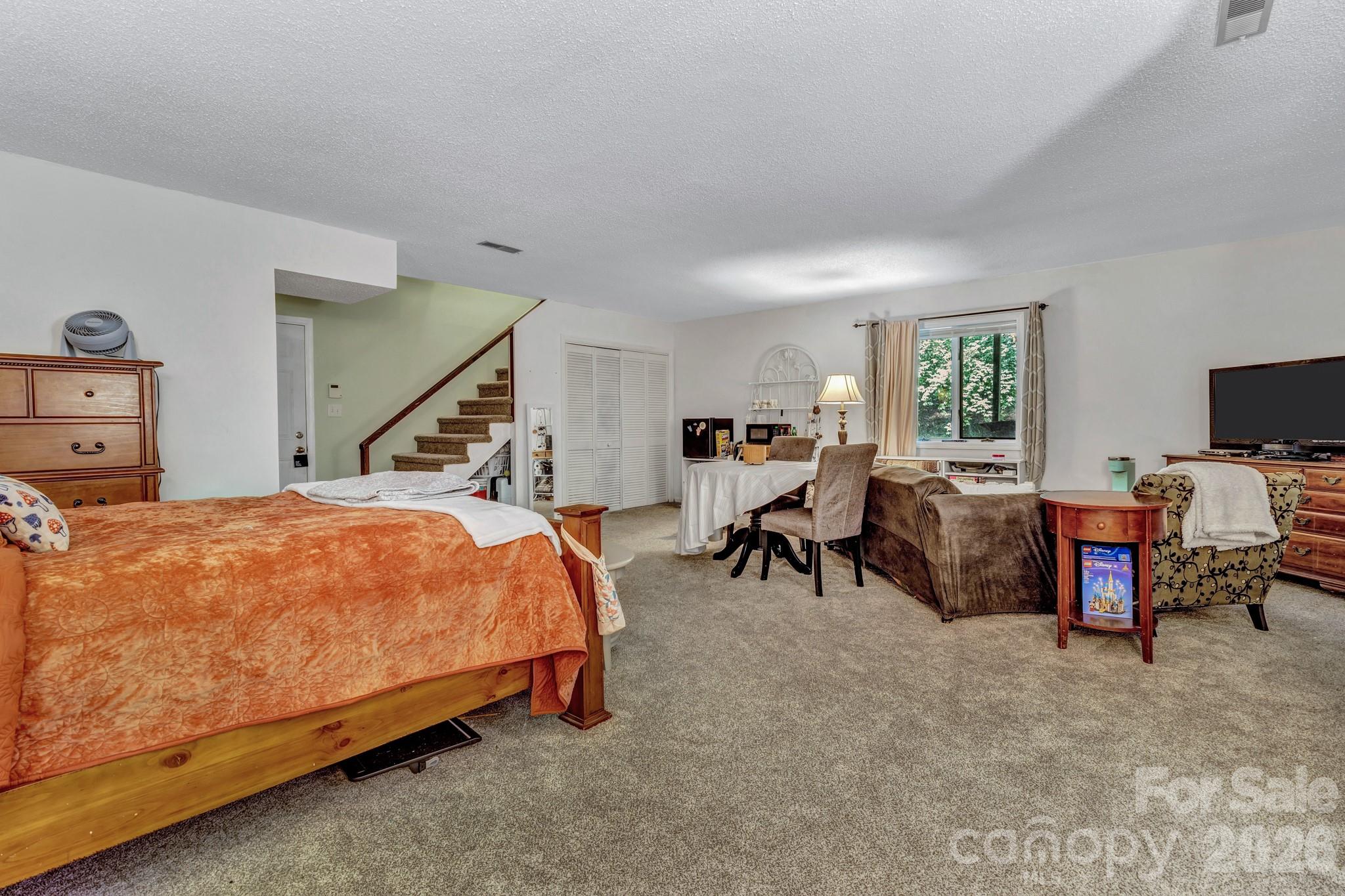 603 Rose Hill Road Asheville, NC 28803 - Photo 39 of 43 a bed room with a bed and furniture