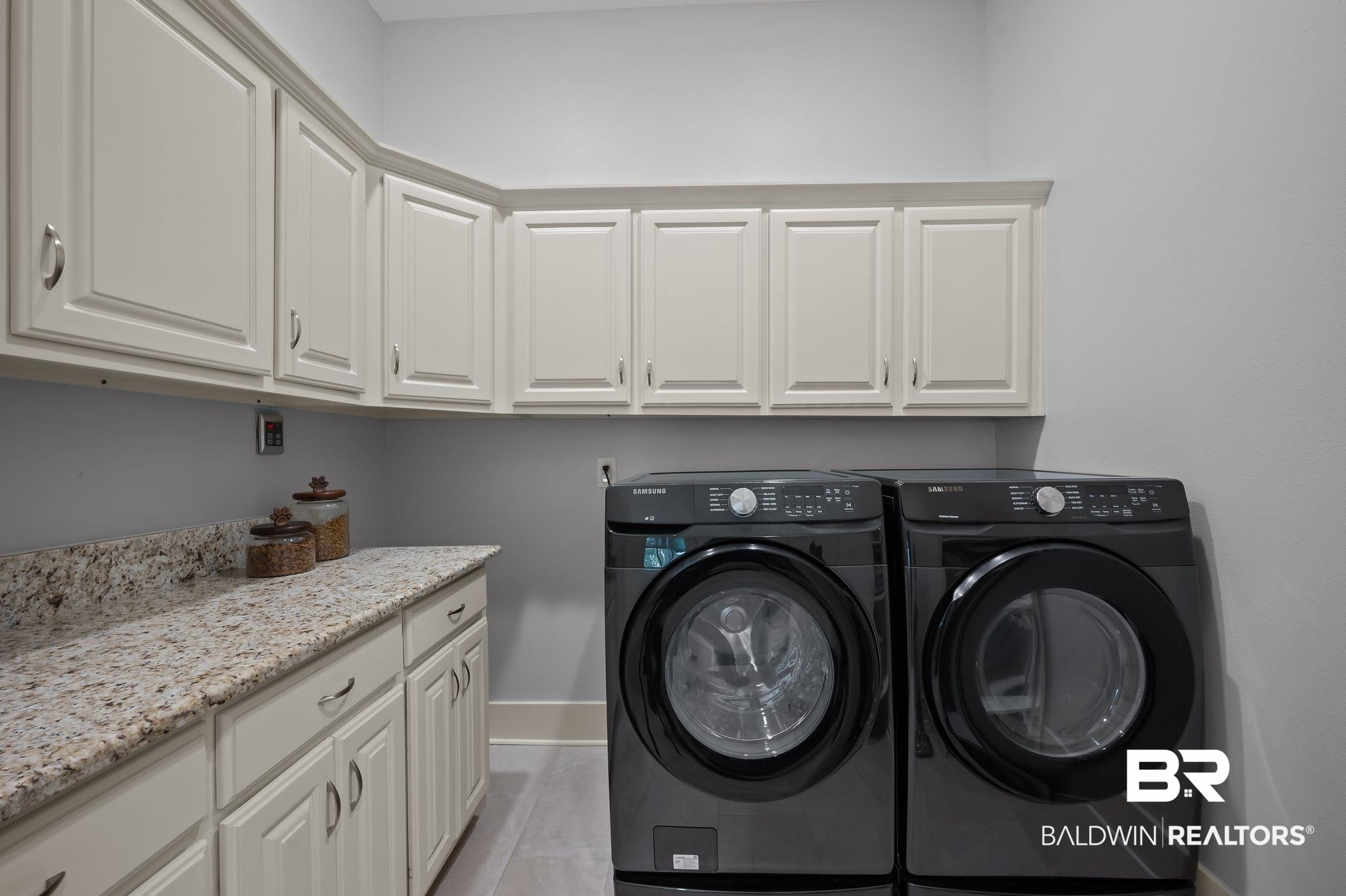 905 Buttercup Lane Foley, AL 36535 - Photo 34 of 47 Laundry room featuring cabinet space and independent washer and dryer