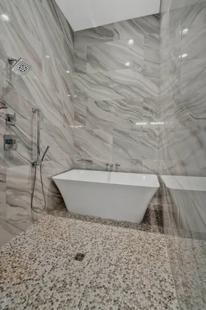 a white tub sitting in a dirt area