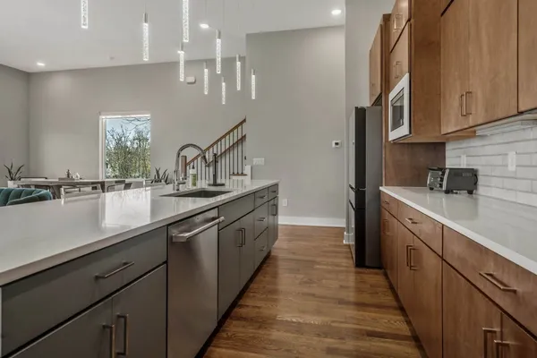 a stove top oven sitting inside of a kitchen