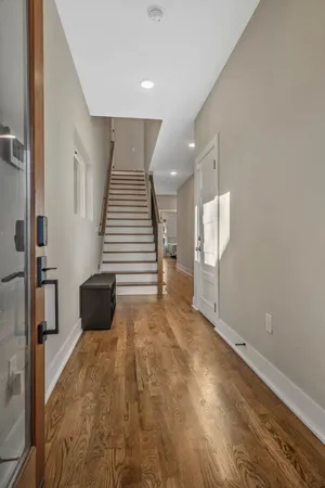 a view of a livingroom with a kitchen