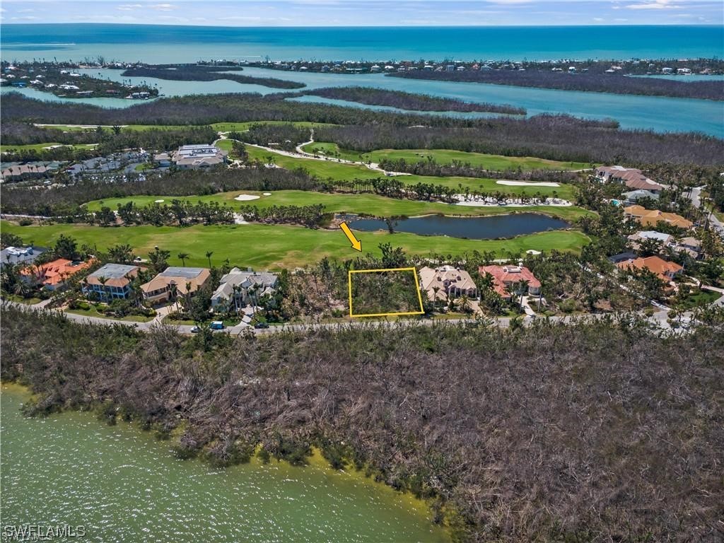 2933 Wulfert Road Sanibel, FL 33957 - Photo 8 of 11 a view of a lake with a mountain