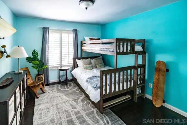 a bedroom with furniture and a window