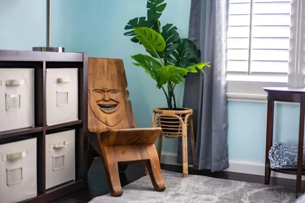 a vase of flowers sitting on a table in front of a window
